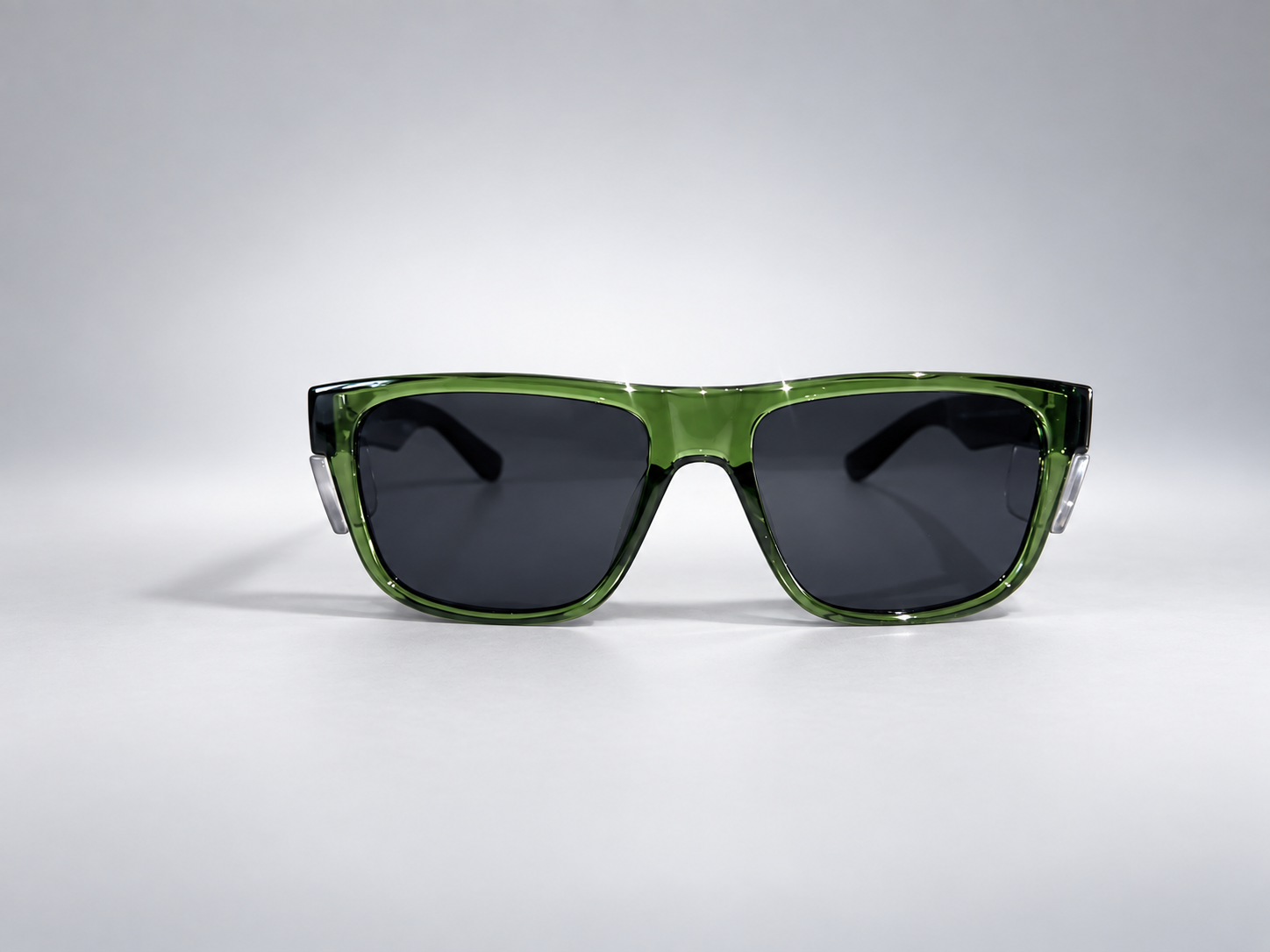 Green frame · Dark lens